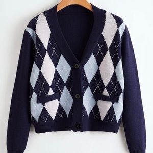 It is a blue cardigan button up.